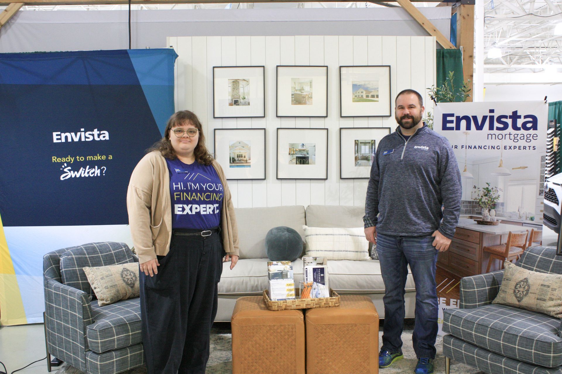 A man and a woman are standing next to each other in a living room.