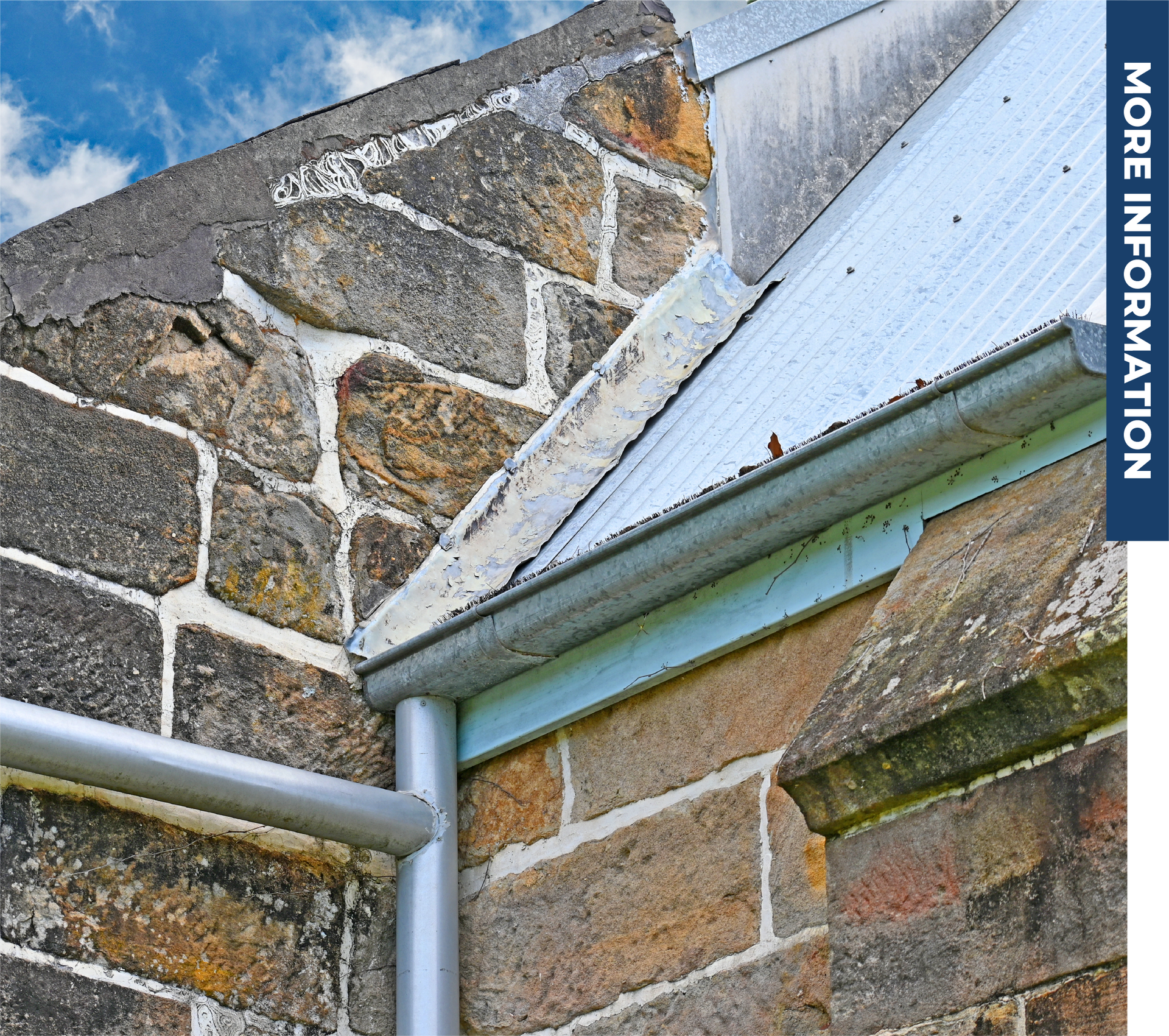 A brick wall with a gutter and a blue banner that says more information