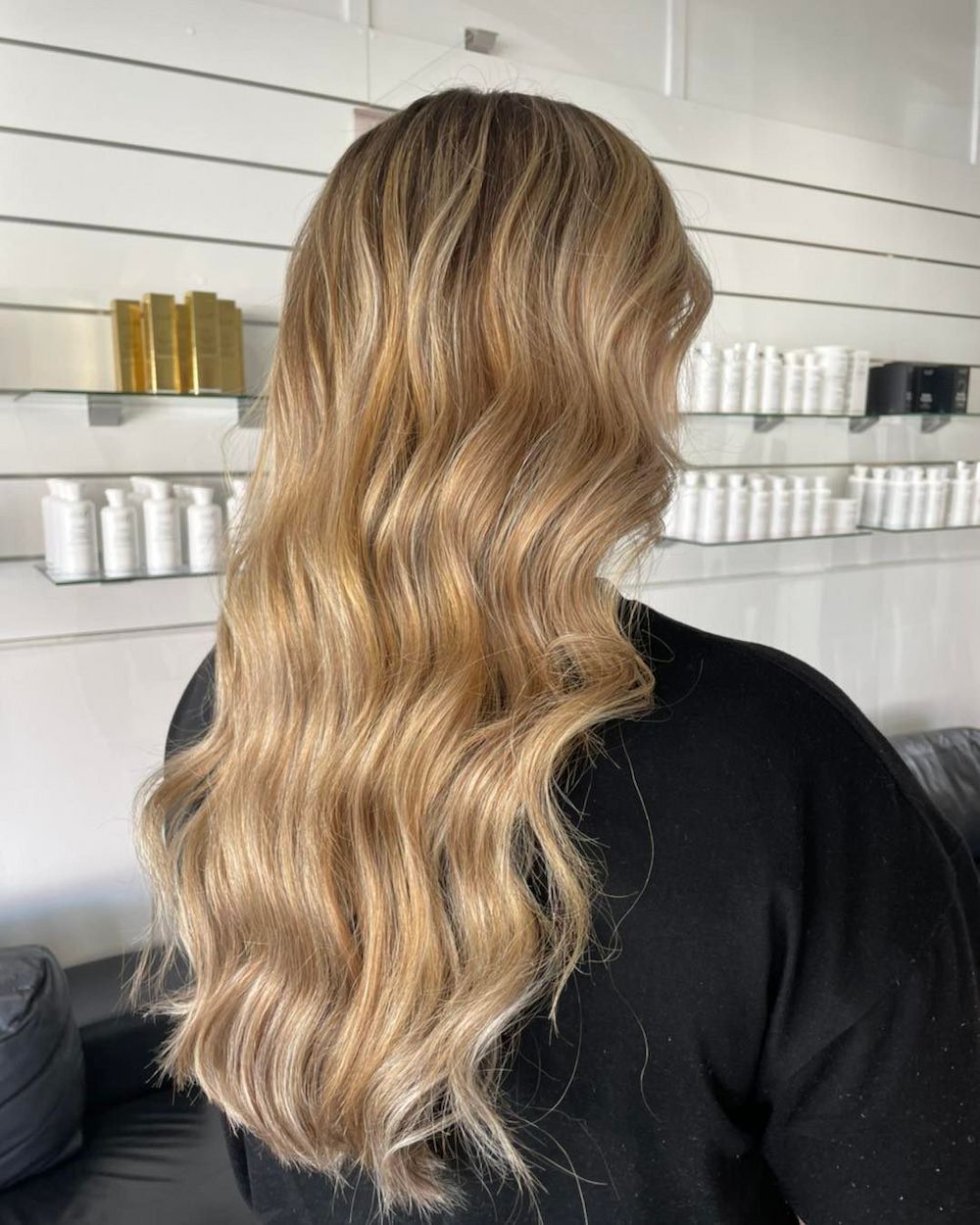 Woman With Long, Wavy Blonde Hair, Styled in a Salon — Strut Hair & Beauty In Maroochydore, QLD
