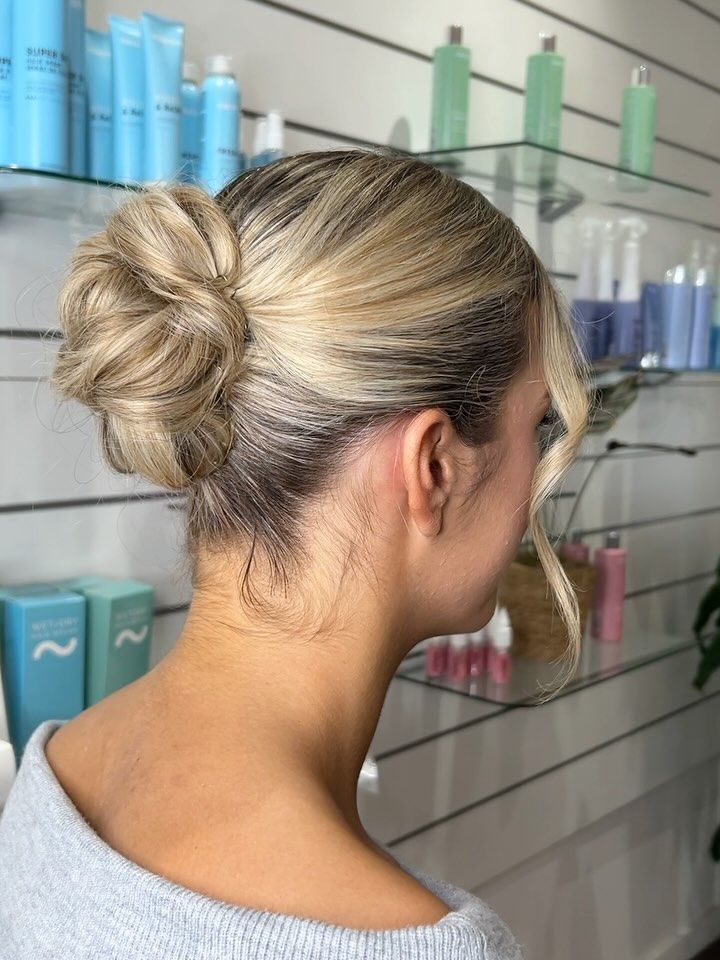 Blonde Woman With Hair in a Bun, Showcasing the Style — Strut Hair & Beauty In Maroochydore, QLD