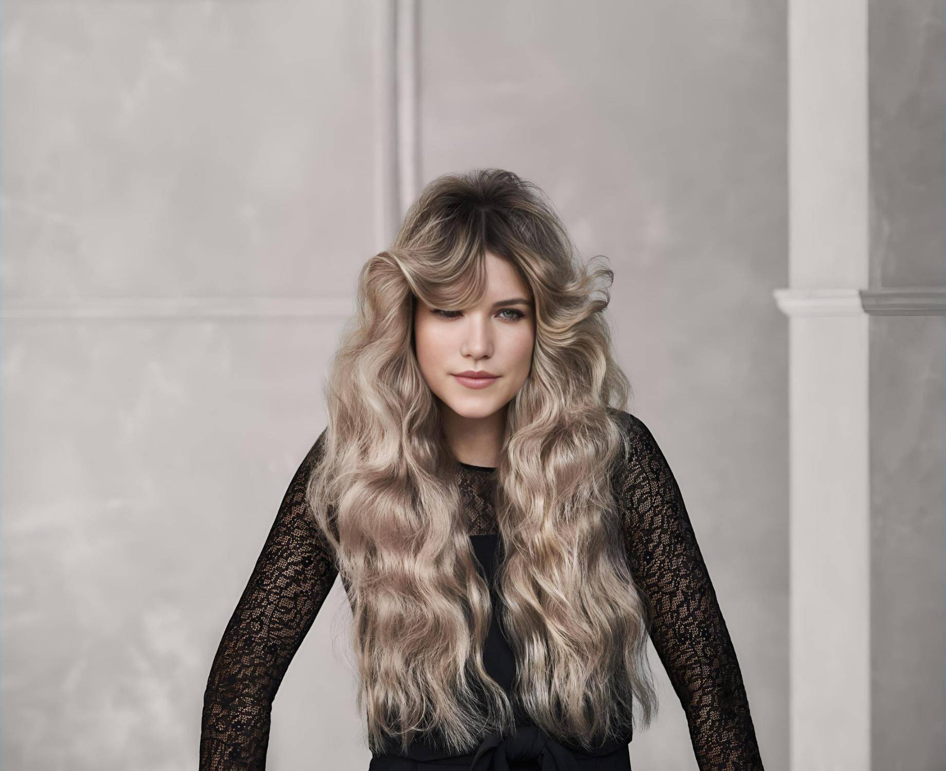 A Woman With Long Blonde Hair is Wearing a Black Lace Dress — Strut Hair & Beauty In Maroochydore, QLD