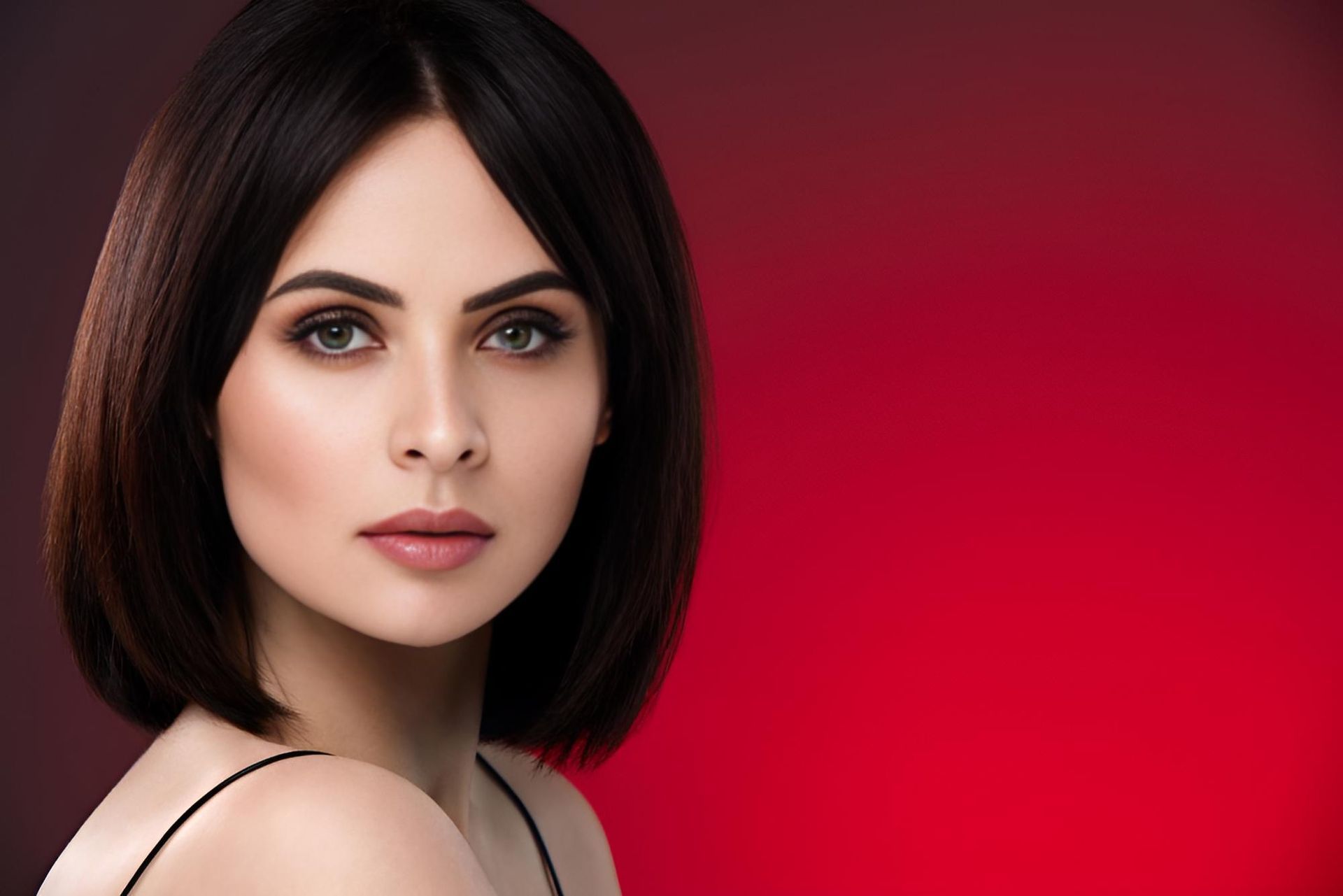 A Close Up of a Woman 's Face on a Red Background — Strut Hair & Beauty In Maroochydore, QLD
