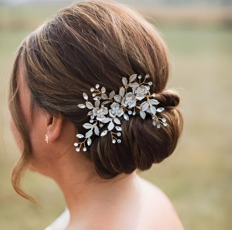 A Woman Wearing a Bun With Flowers in Her Hair — Strut Hair & Beauty In Maroochydore, QLD