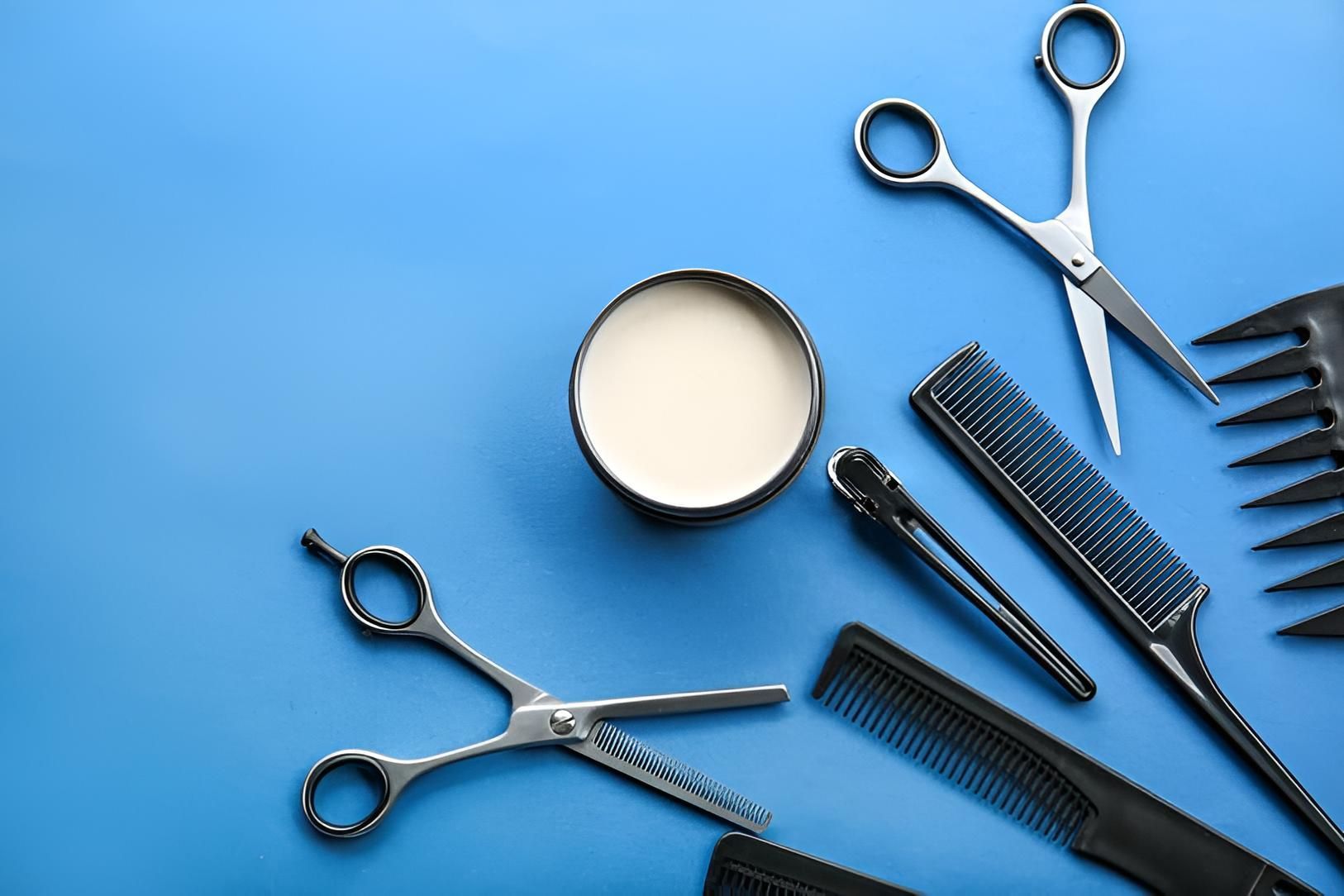 A Pair of Scissors , Combs , and a Bowl of Wax on a Blue Background — Strut Hair & Beauty In Maroochydore, QLD