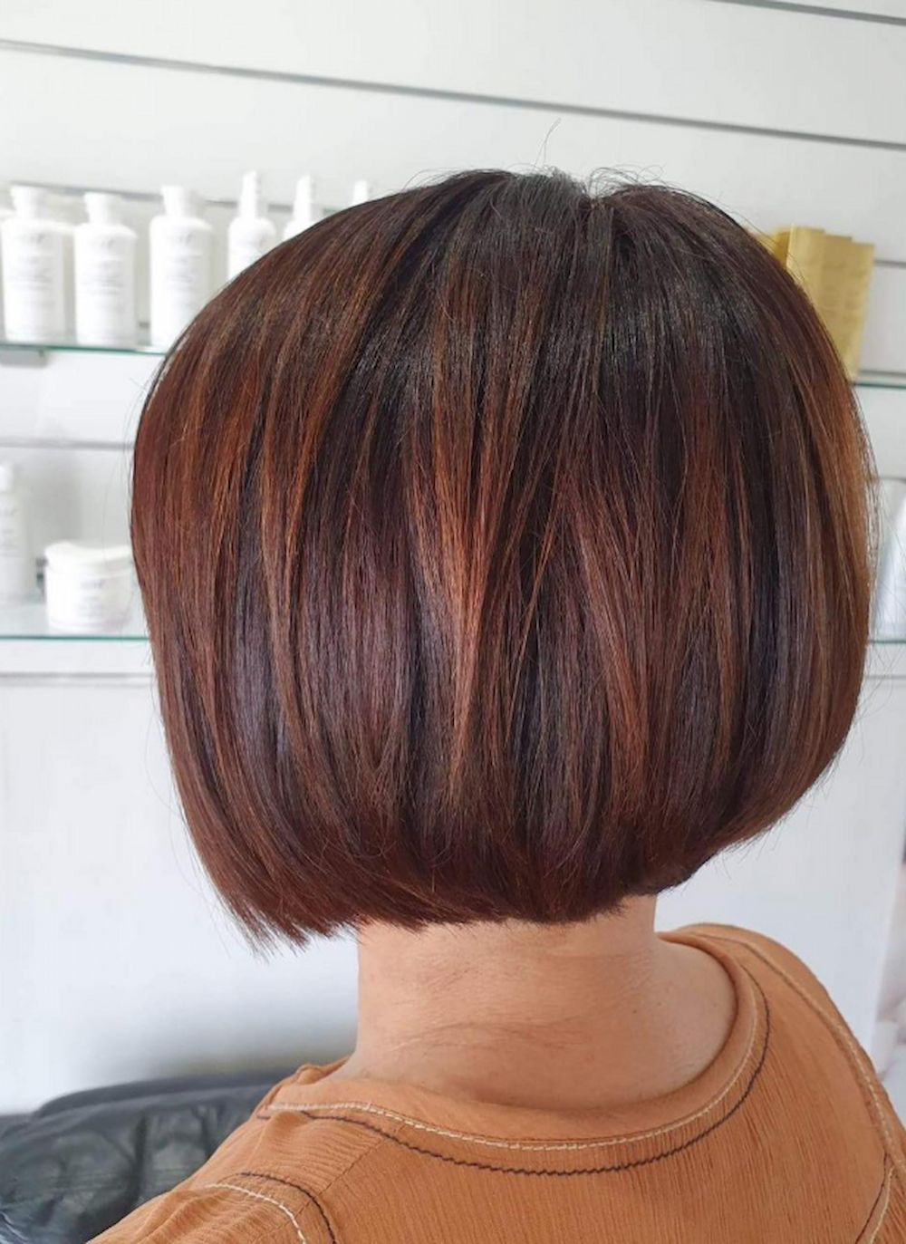 Woman With a Short, Angled Bob Hairstyle, Brown Hair With Auburn Highlights — Strut Hair & Beauty In Maroochydore, QLD