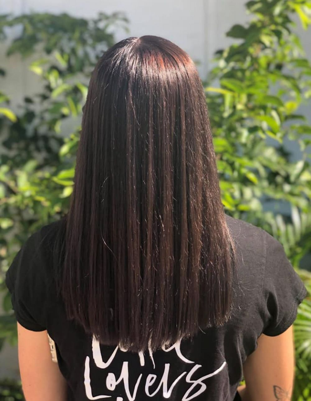 Woman With Long, Straight, Dark Brown Hair, Wearing a Black T-shirt — Strut Hair & Beauty In Maroochydore, QLD