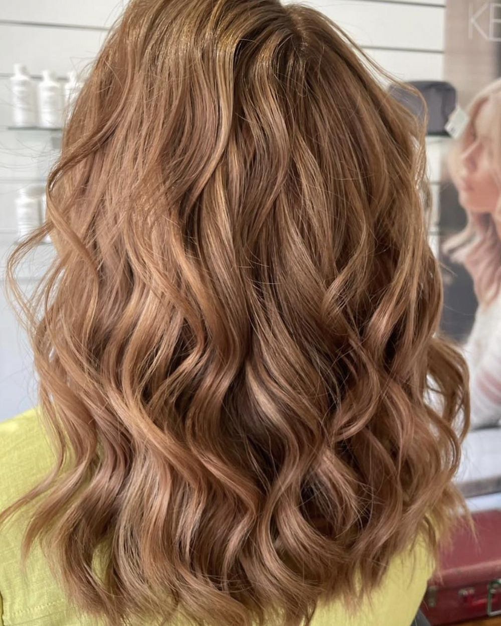 Woman With Wavy Brown Hair Highlighted With Blonde, in a Salon — Strut Hair & Beauty In Maroochydore, QLD