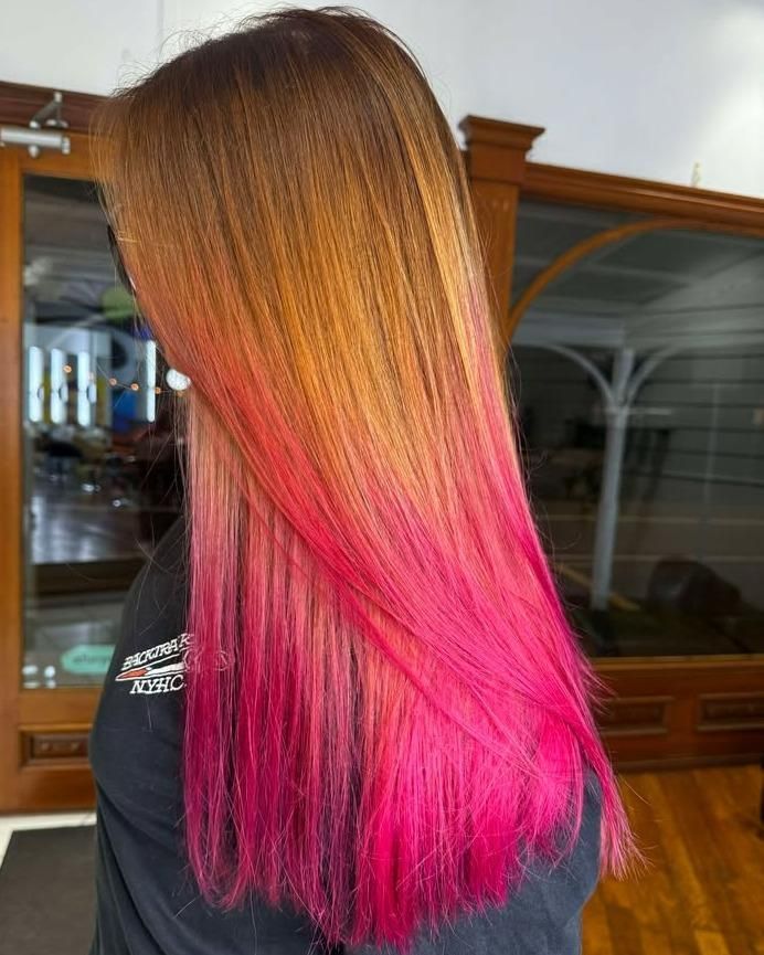 Woman with ombre hair, transitioning from brown to bright pink — Strut Hair & Beauty In Maroochydore, QLD