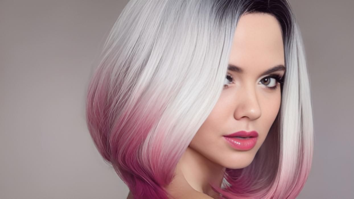 A Woman With Short White and Pink Hair is Looking at the Camera — Strut Hair & Beauty In Maroochydore, QLD