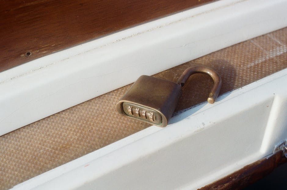 A photo of a boat lock for the cabin on the rail of the boat. 