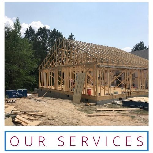 Framed house under construction with “OUR SERVICES” text below.