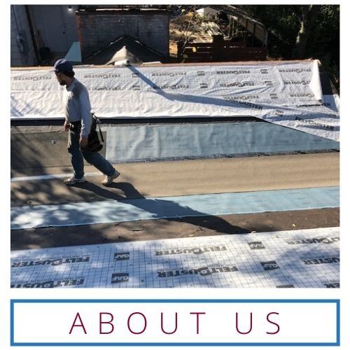 Worker on a rooftop covered in waterproofing membrane, with 