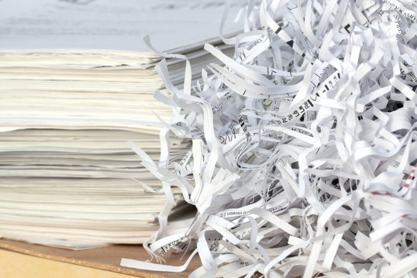 A pile of shredded paper is sitting on top of a pile of shredded paper.