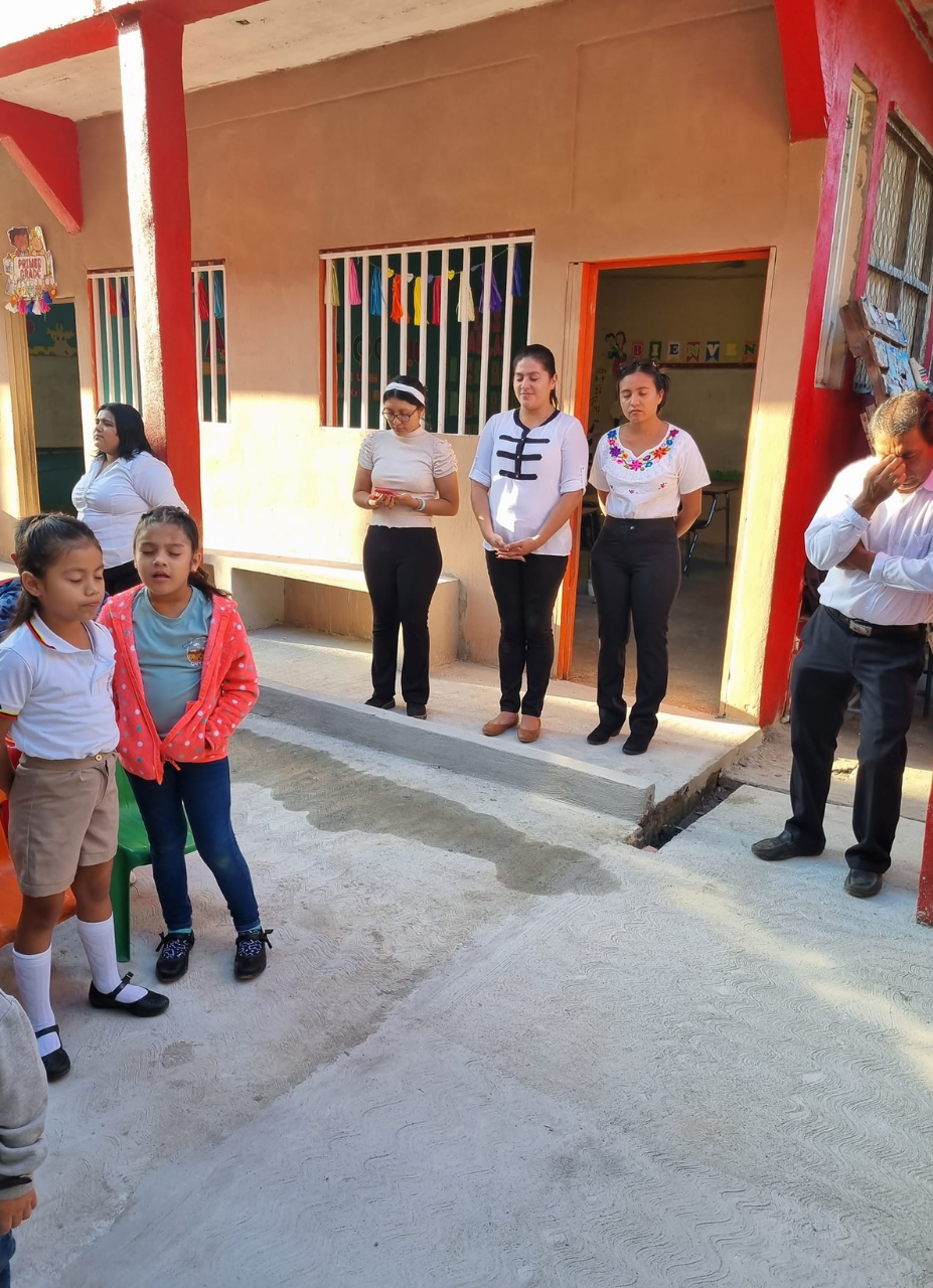 a group of people are standing outside of a building .