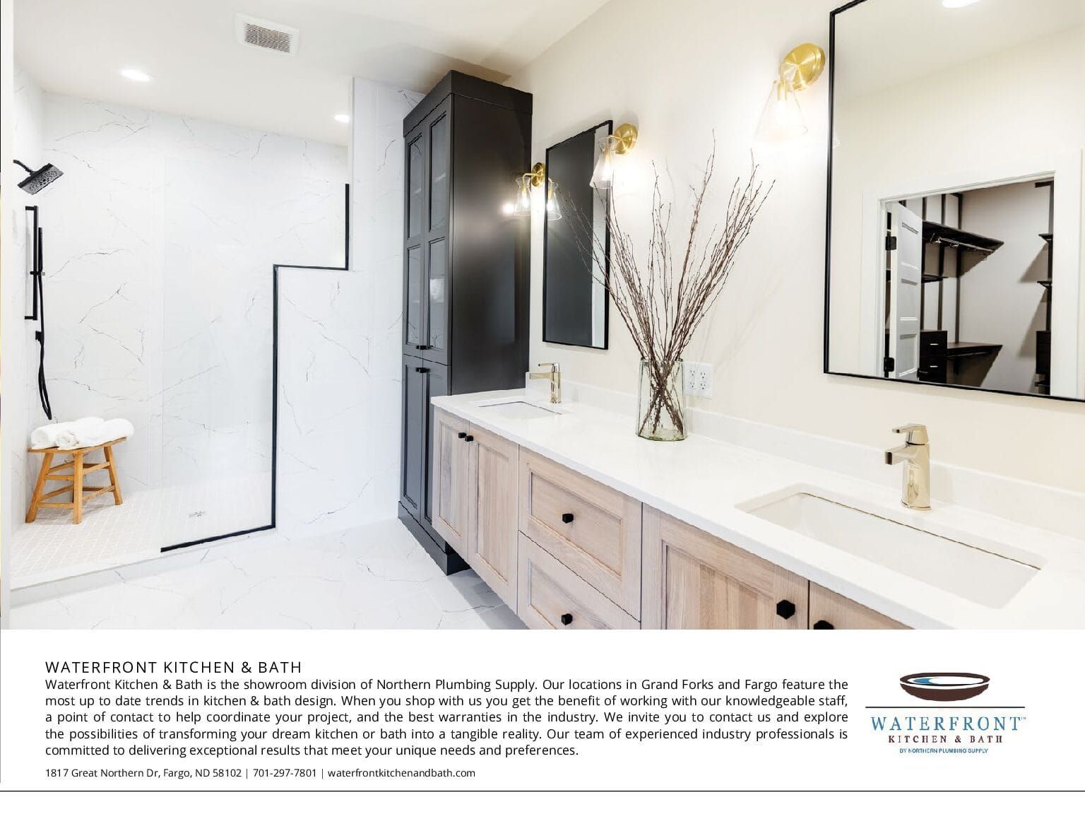 Modern bathroom with black accents, light wood vanity, and gold fixtures.