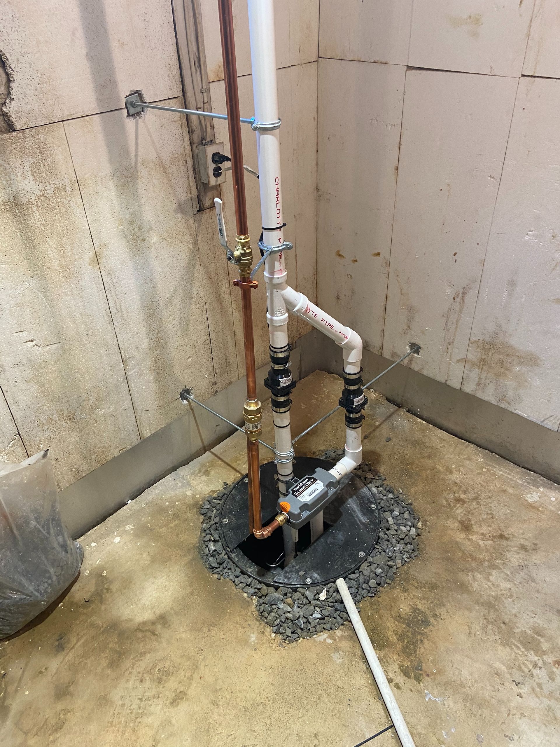 A White Laundry Sink In A Basement — Hockessin, DE — Wolfe Plumbing LLC