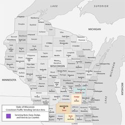 Map of Wisconsin counties with a legend highlighting outbreak risk levels in colored counties.