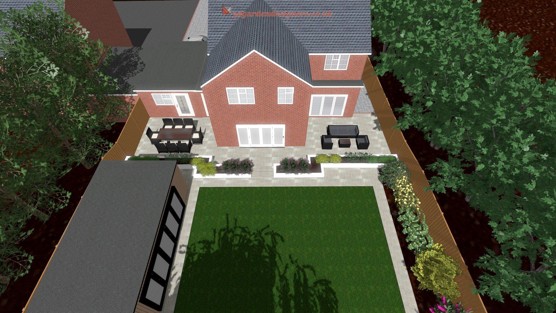 An aerial view of a large brick house with a large lawn in front of it.