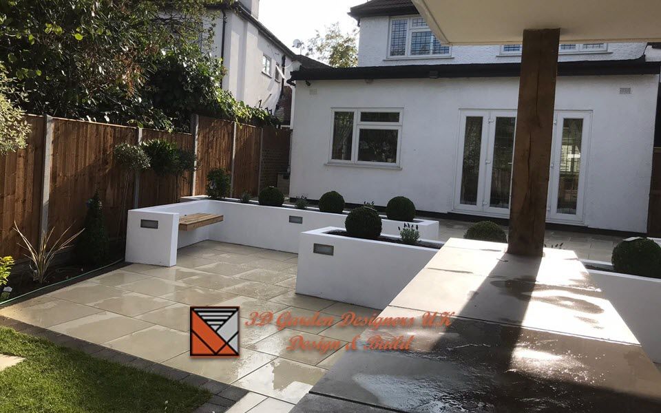 A white house with a patio in front of it