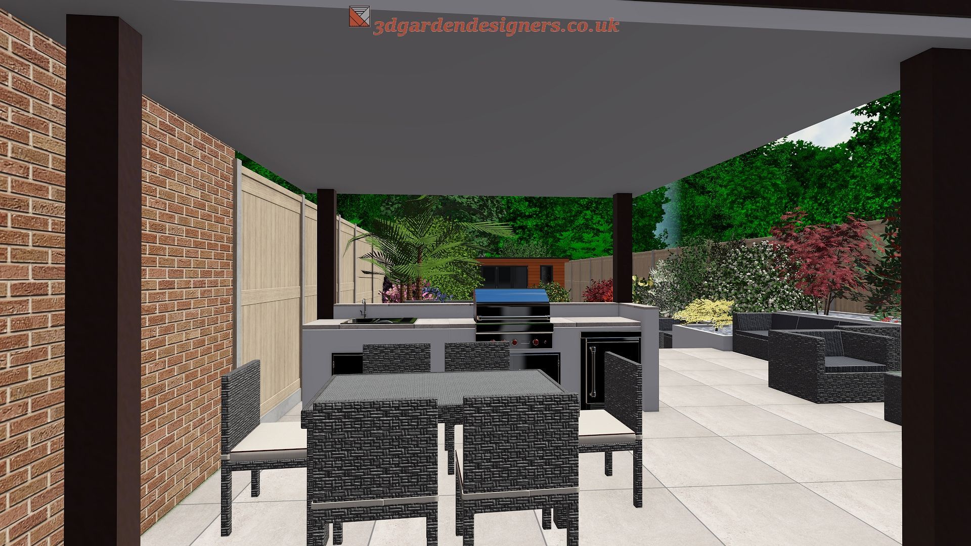 Outdoor kitchen with dining area under a shaded structure. Concrete counters, grill, and seating. Lush green backdrop.