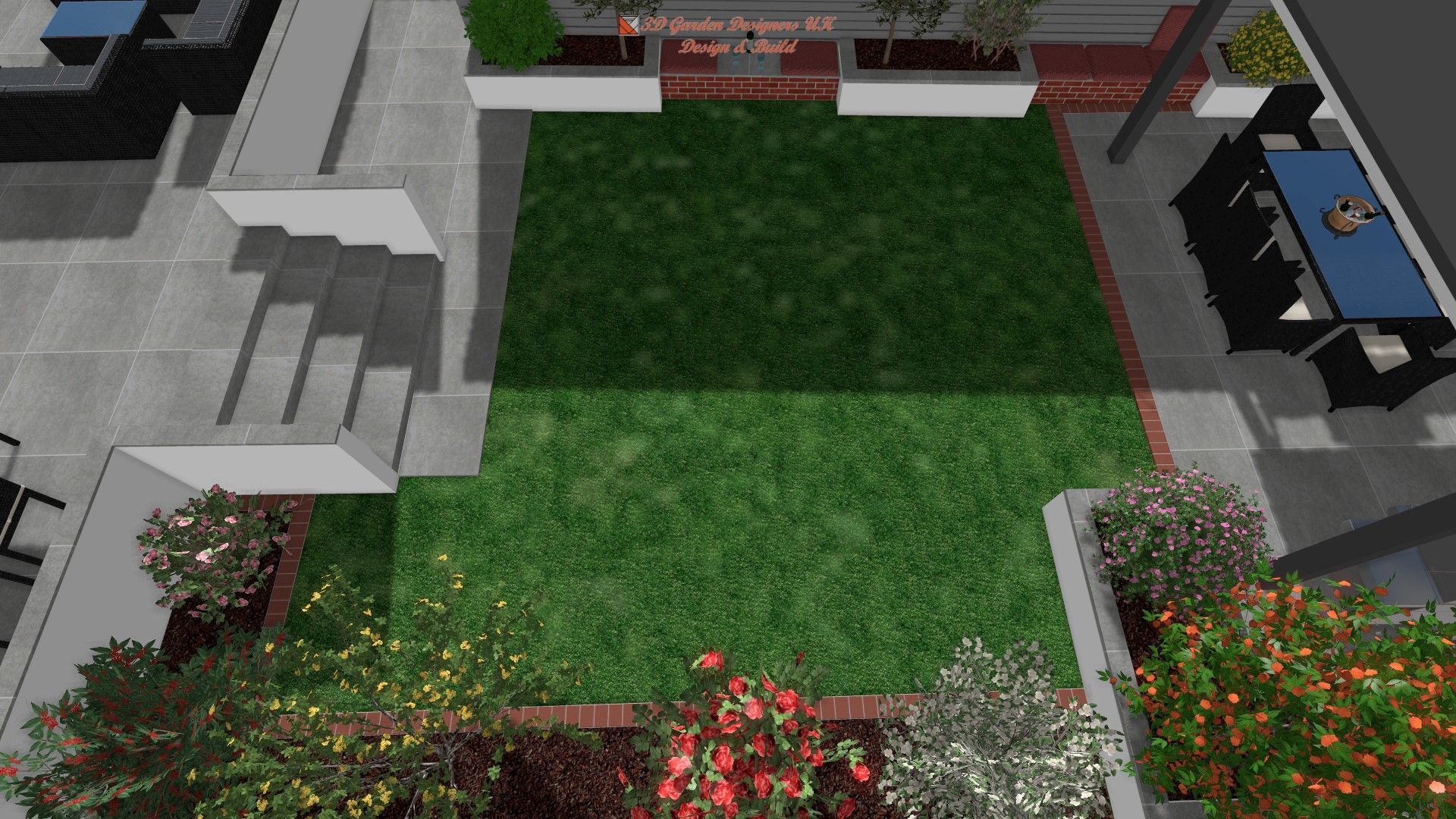 An aerial view of a garden with a lush green lawn and flowers.