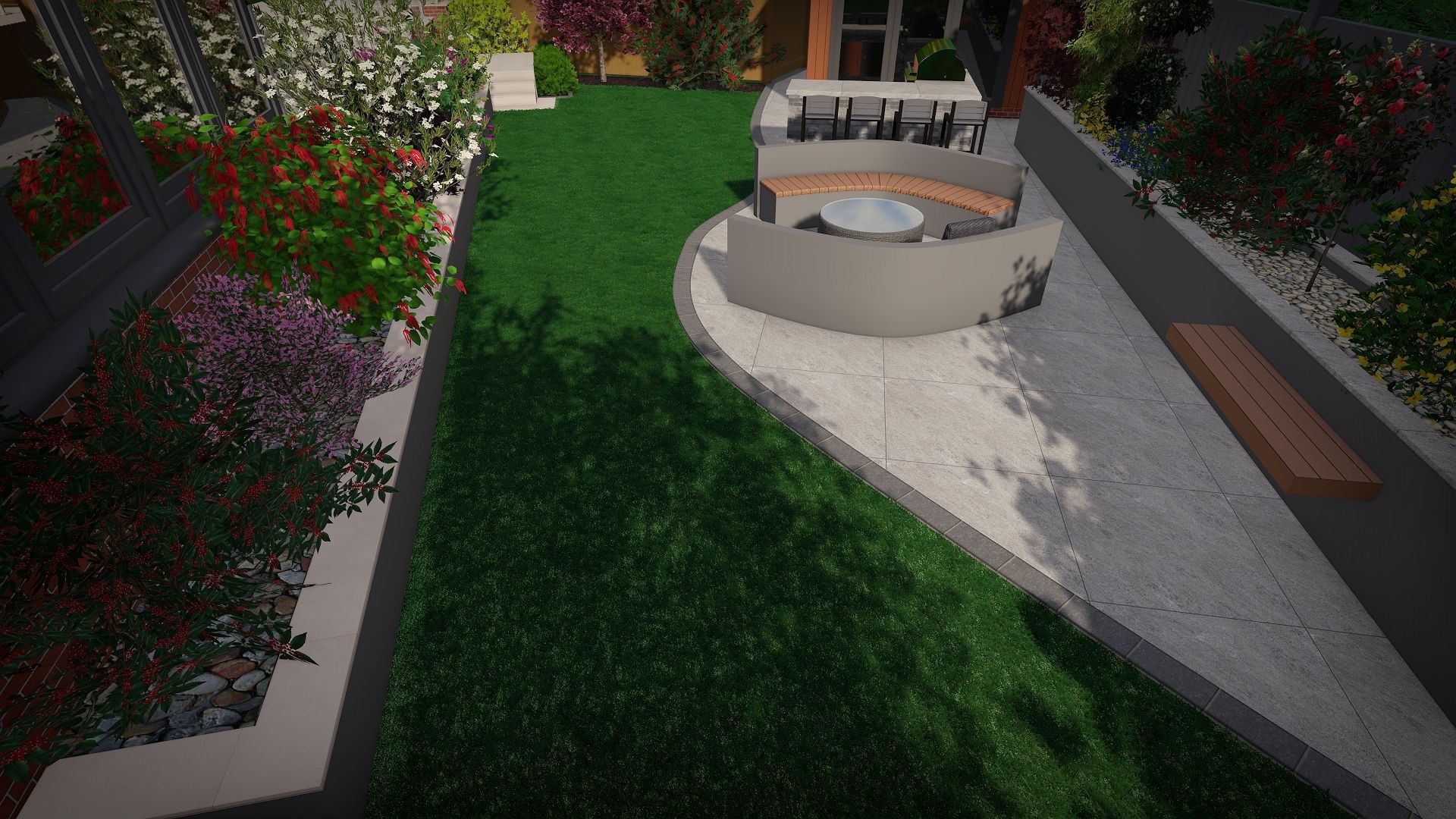 Overhead view of a landscaped backyard with lawn, stone walls, and a seating area with a fire pit.