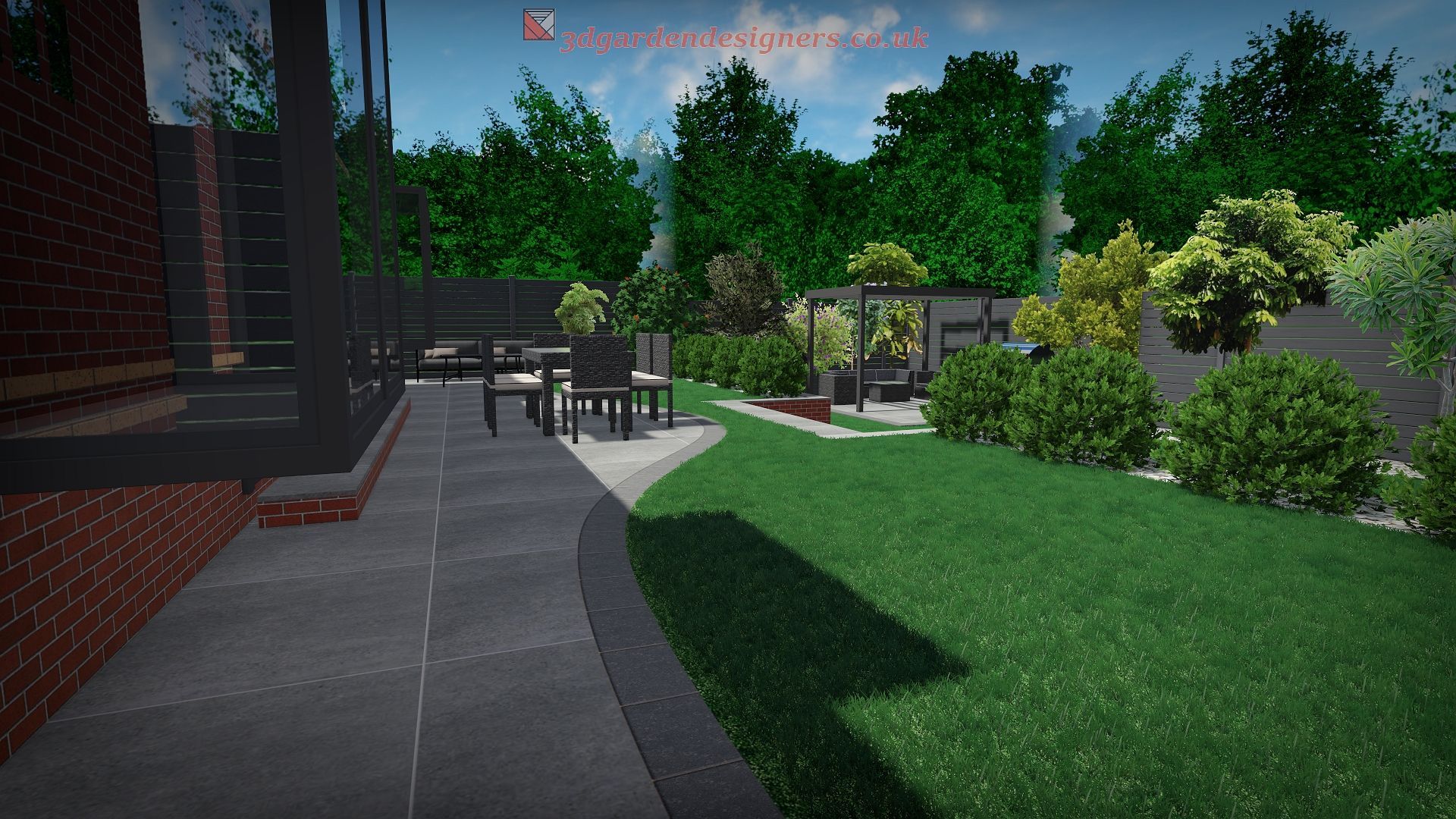 A backyard patio with seating, bordered by green grass, plants, and trees, bathed in sunlight.