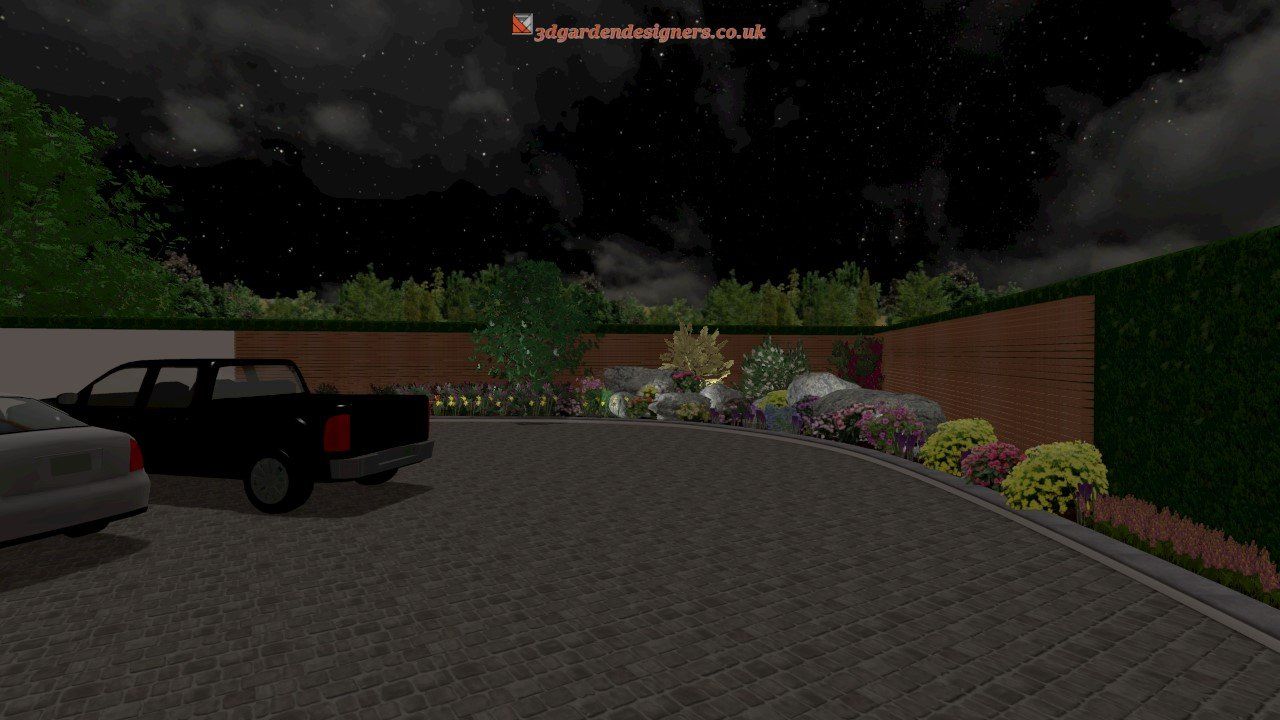 A black truck is parked in a parking lot at night.