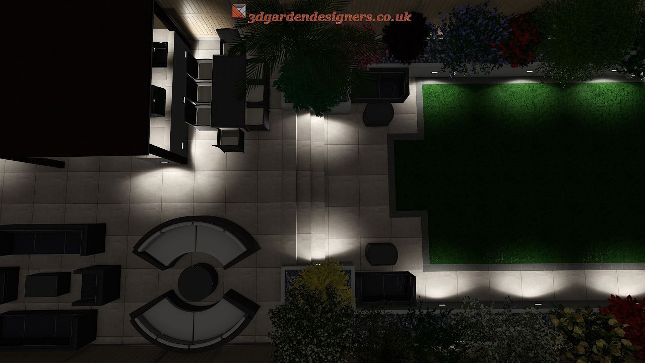 Overhead night view of a patio with illuminated seating areas, a dining table, and a grass section surrounded by plants.