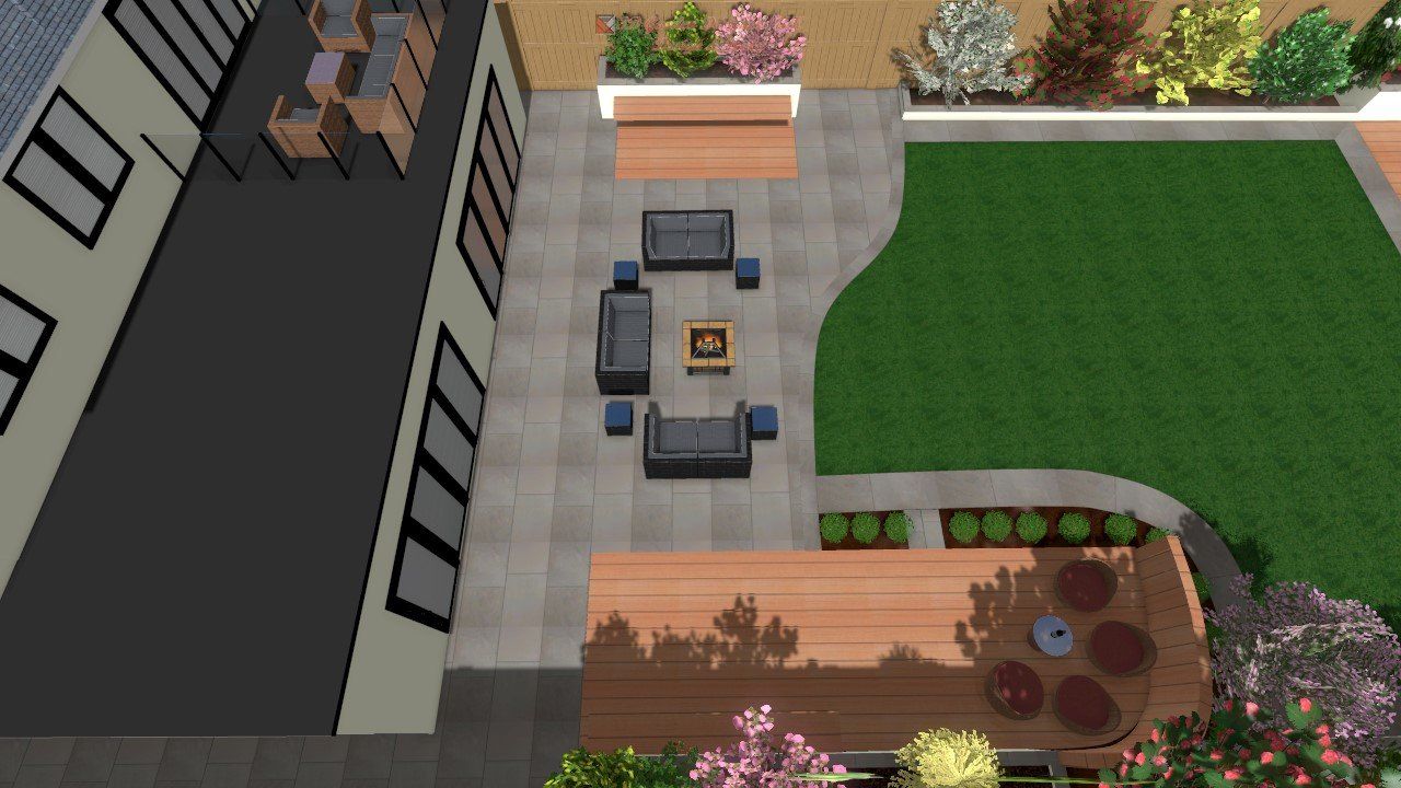 An aerial view of a garden with a table and chairs
