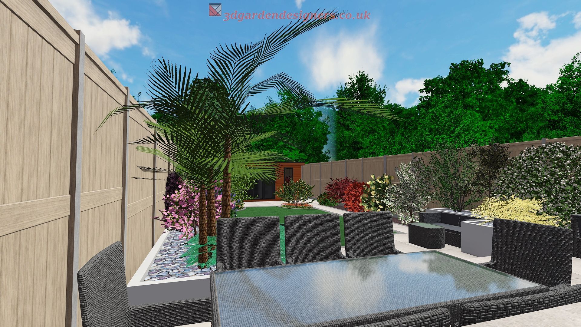 Backyard patio with wicker furniture, palms, and a garden against a wooden fence.