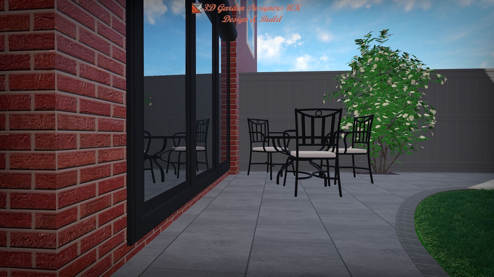 A patio with a table and chairs in front of a brick building.