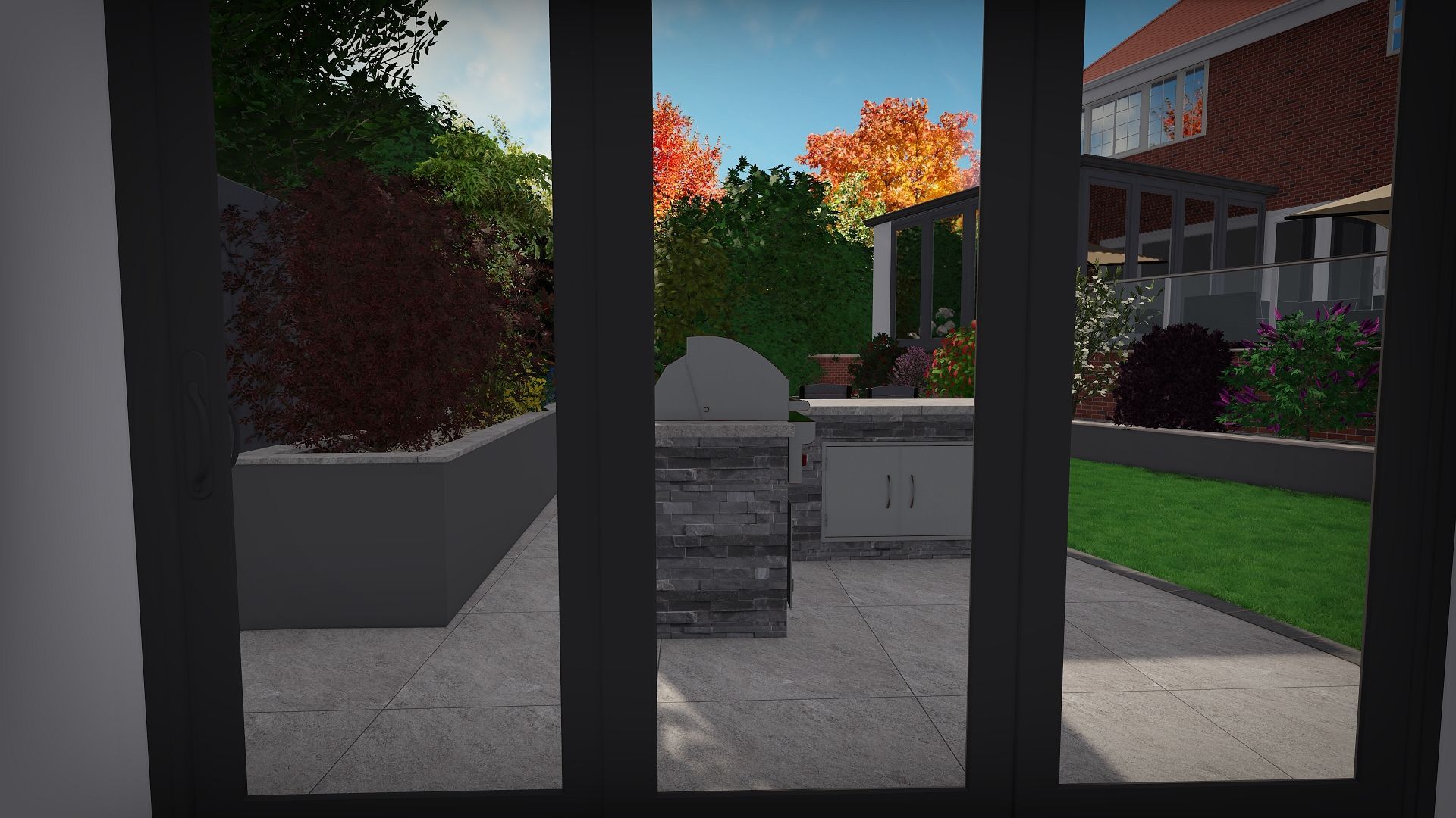 View through black-framed doors of a patio with a grill, planters, and a home on a sunny day.