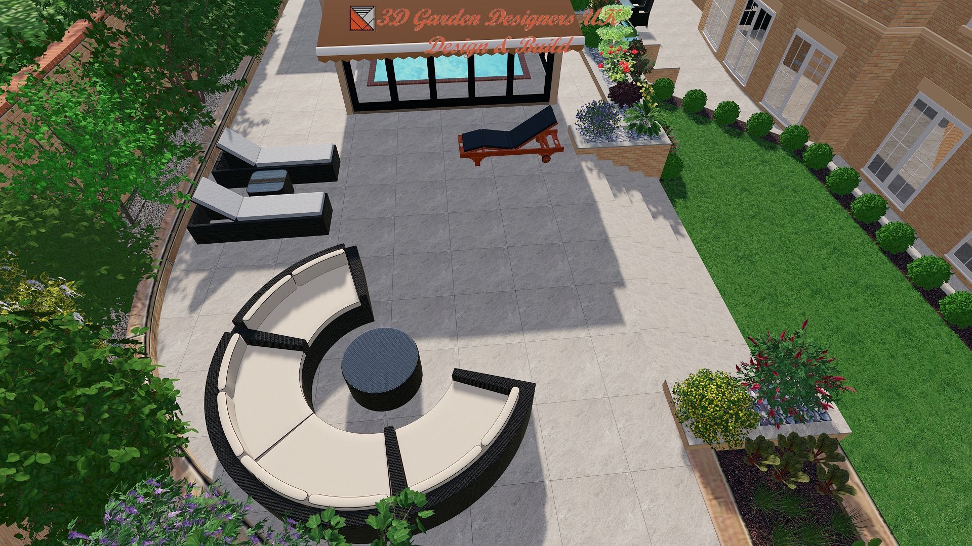 An aerial view of a patio with furniture and a pool.