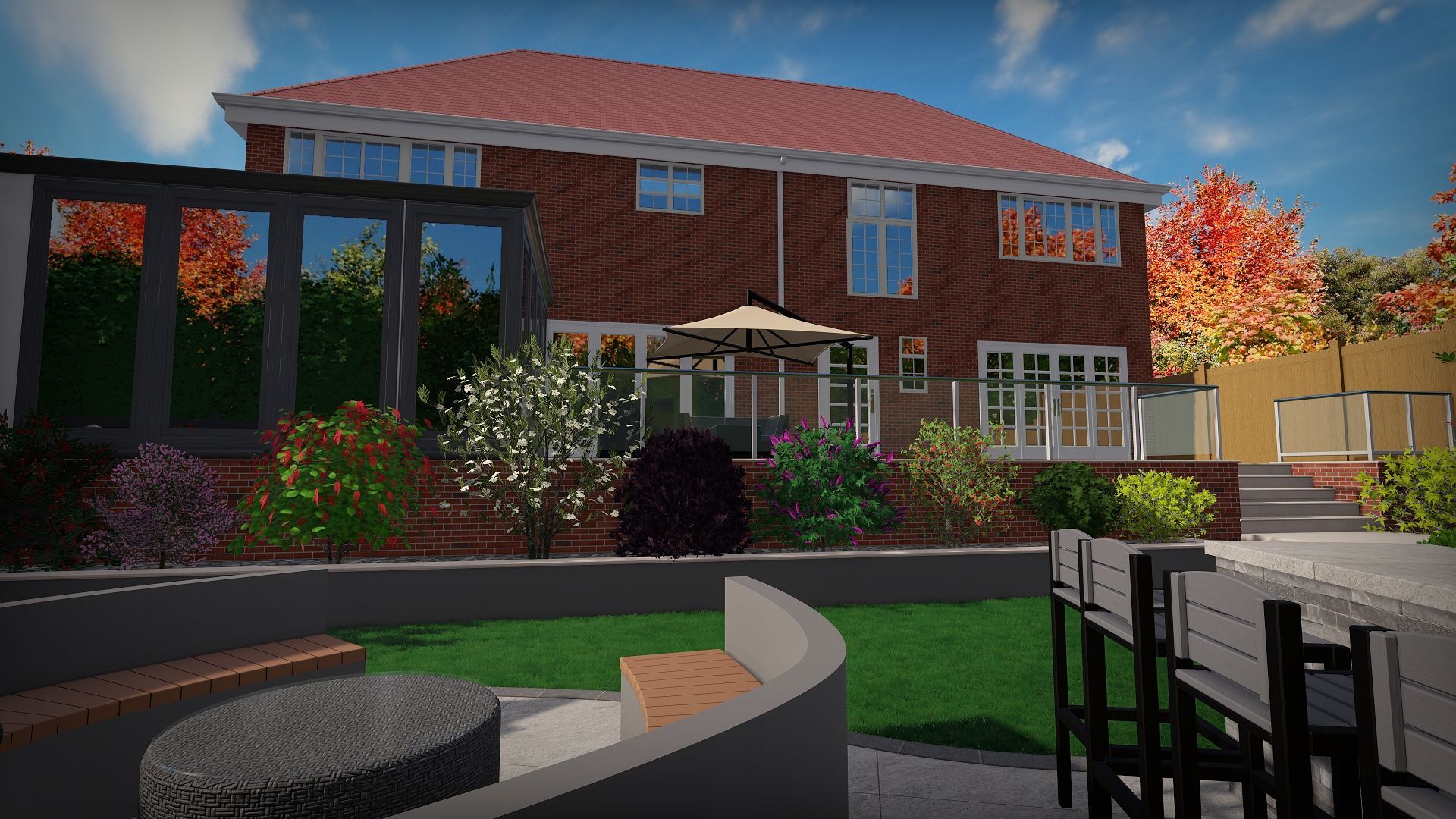 Backyard view of a two-story brick house with landscaping, patio seating, and colorful autumn foliage.