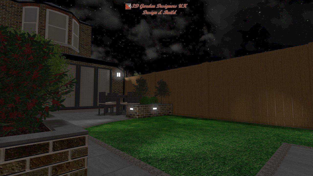A backyard with a wooden fence and a brick wall at night.