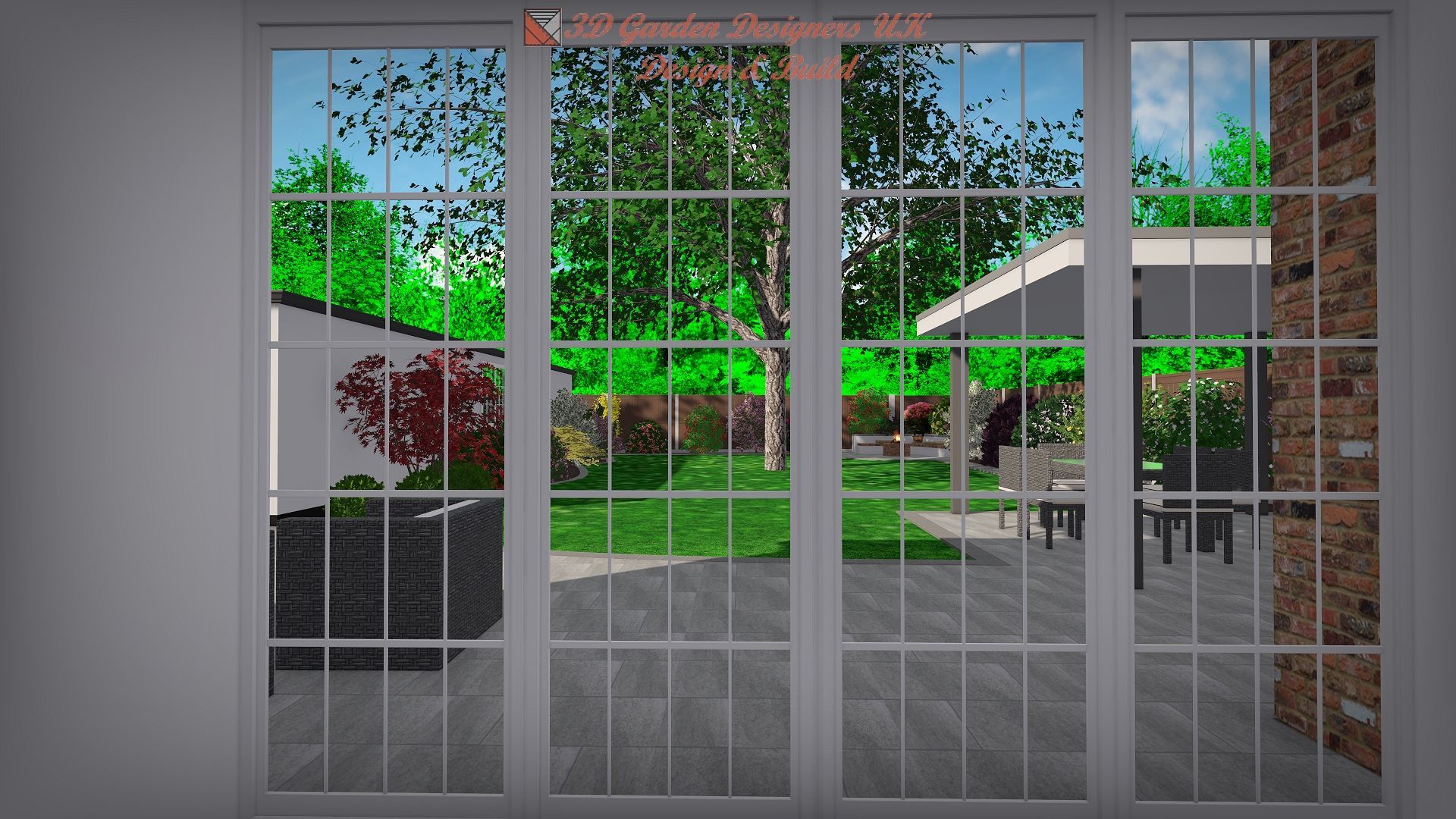 View through a glass door: backyard with green lawn, trees, patio furniture, and a white wall with a red heart design.