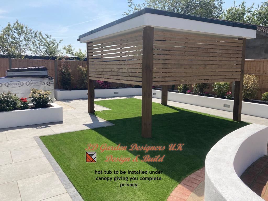 A wooden gazebo is sitting in the middle of a lush green garden.