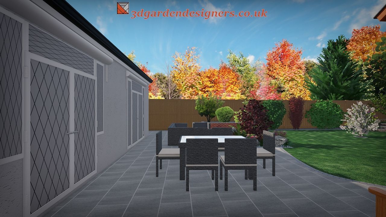 Patio with a dining table and chairs, gray pavers, house, and autumn trees.