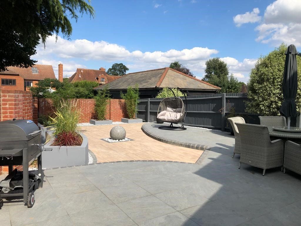 There is a fire pit in the middle of the backyard.