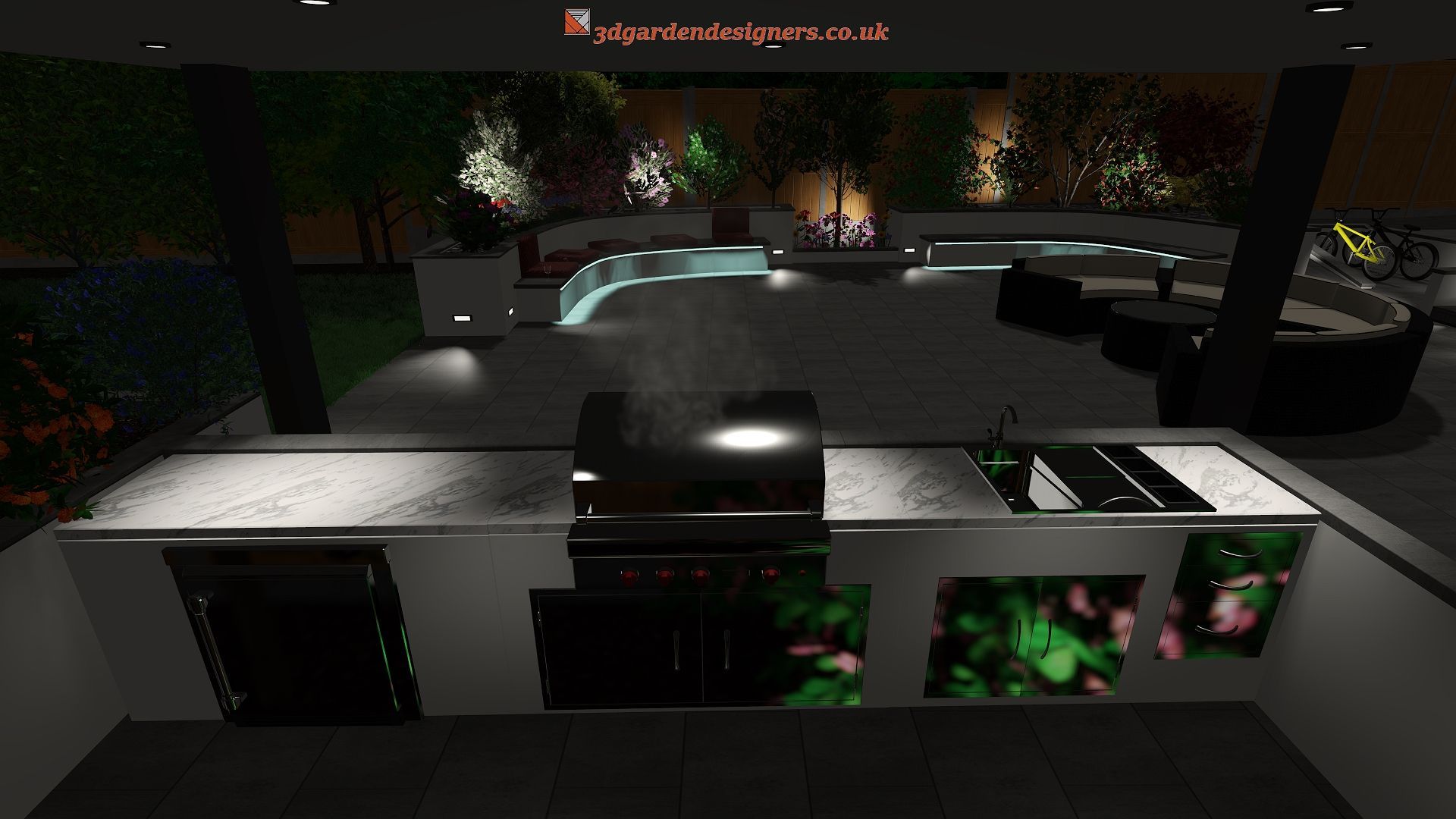 Outdoor kitchen with grill, sink, and storage; dark patio setting with garden in the background.