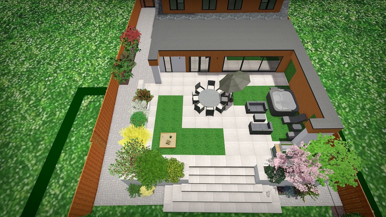 An aerial view of a house with a patio and a table and chairs in the backyard.