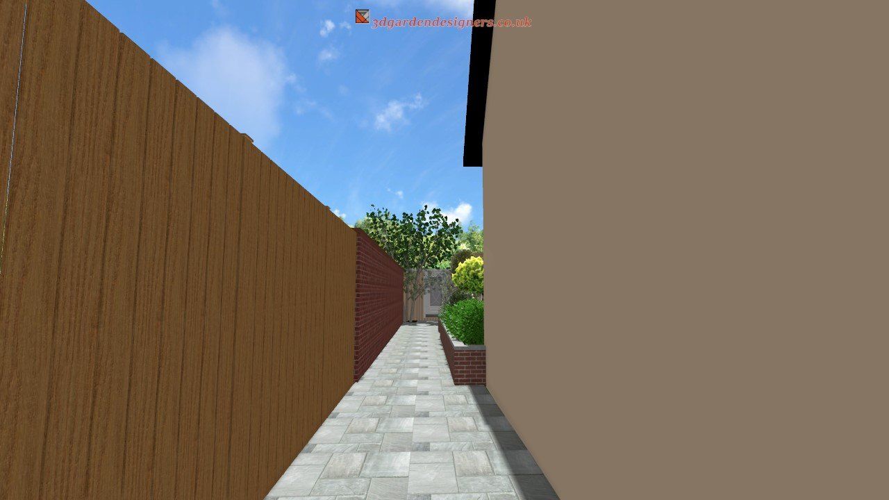 A narrow walkway between two buildings with a wooden fence.