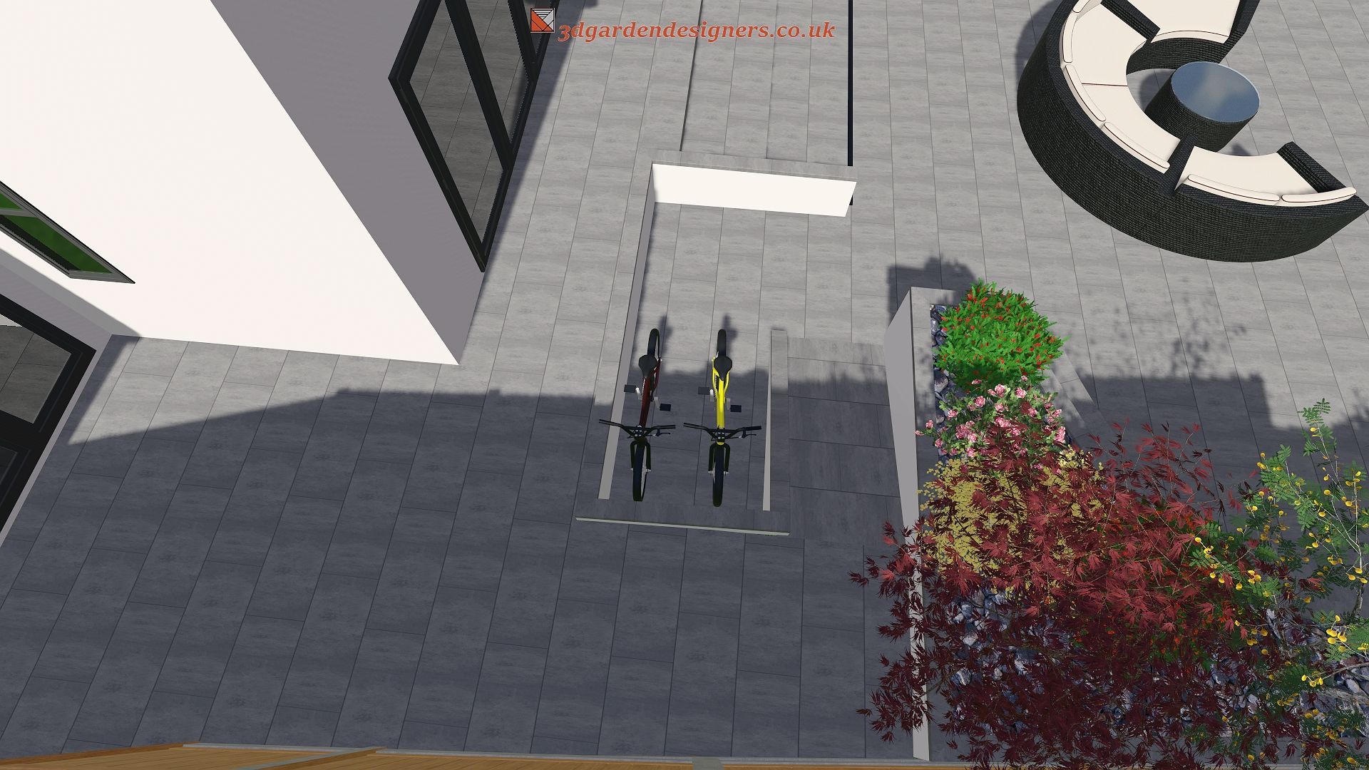 View from above of three bicycles parked in a bike rack outside a modern building.