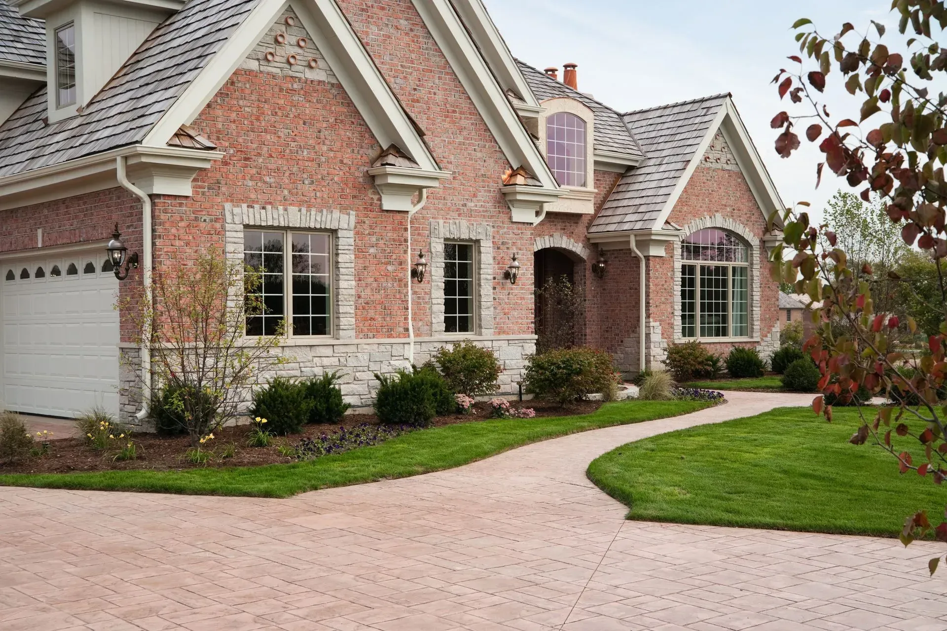 Home with a beautiful stamped concrete driveway in a residential neighborhood in NJ.
