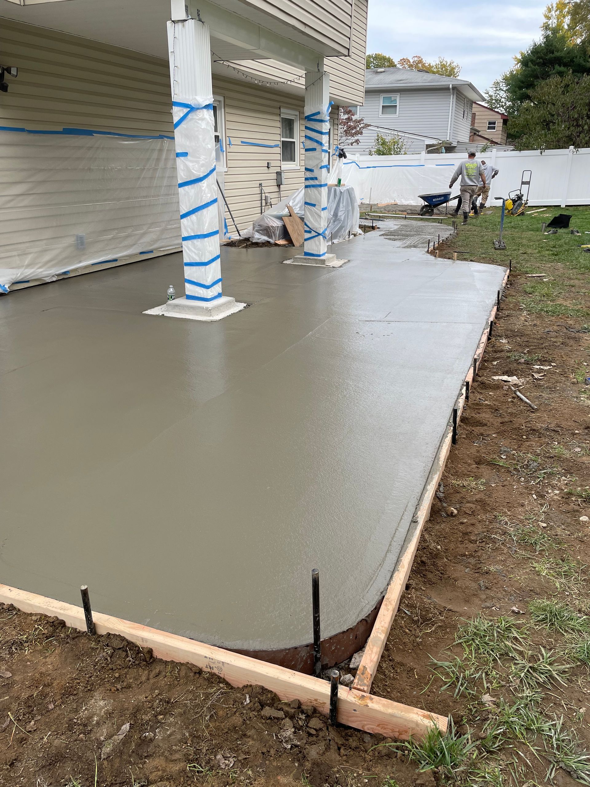 A concrete patio is being built in a house.