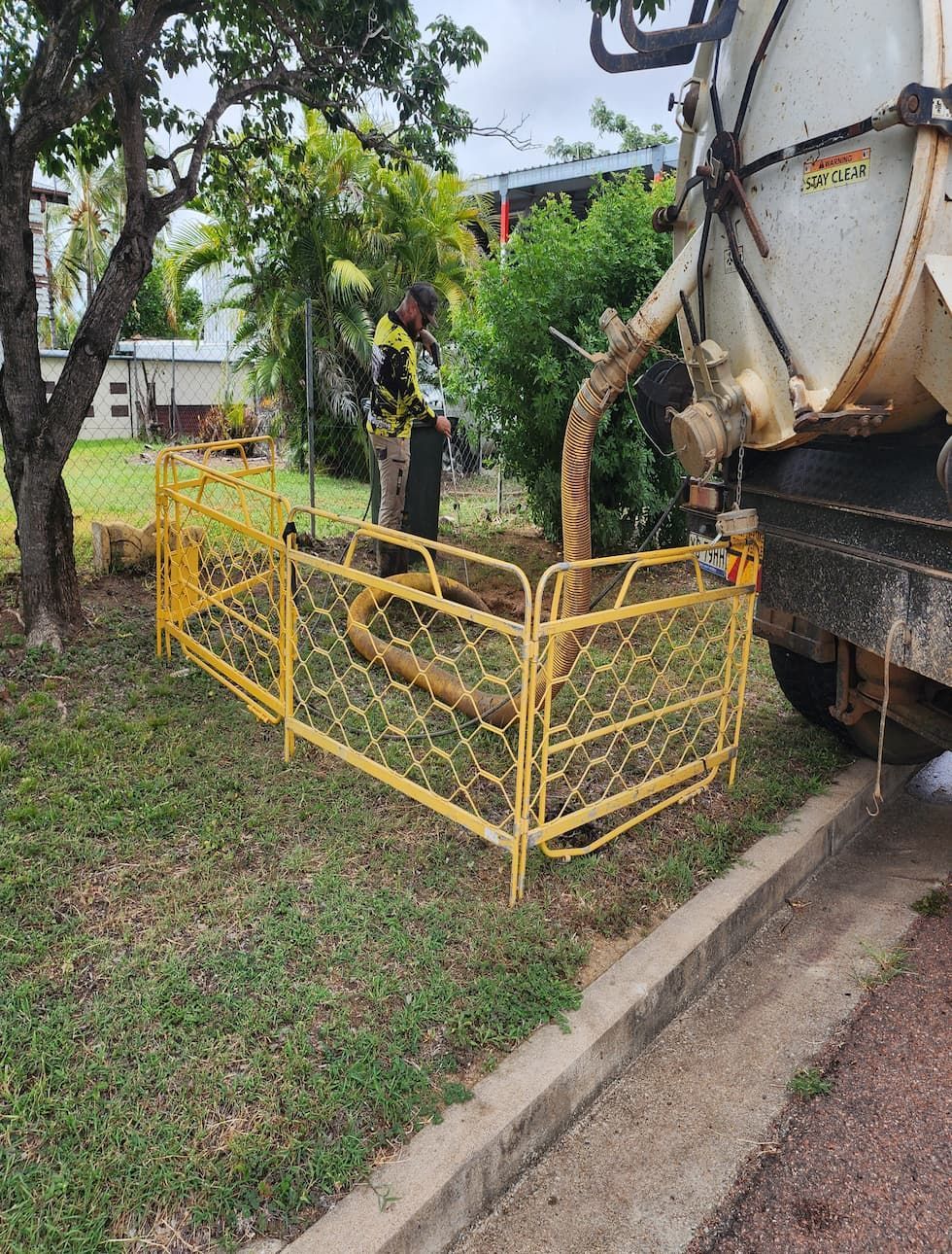 A Couple Of Palm Trees Standing Next To A Body Of Water — ViperVac Solutions PTY LTD in Airlie Beach, QLD