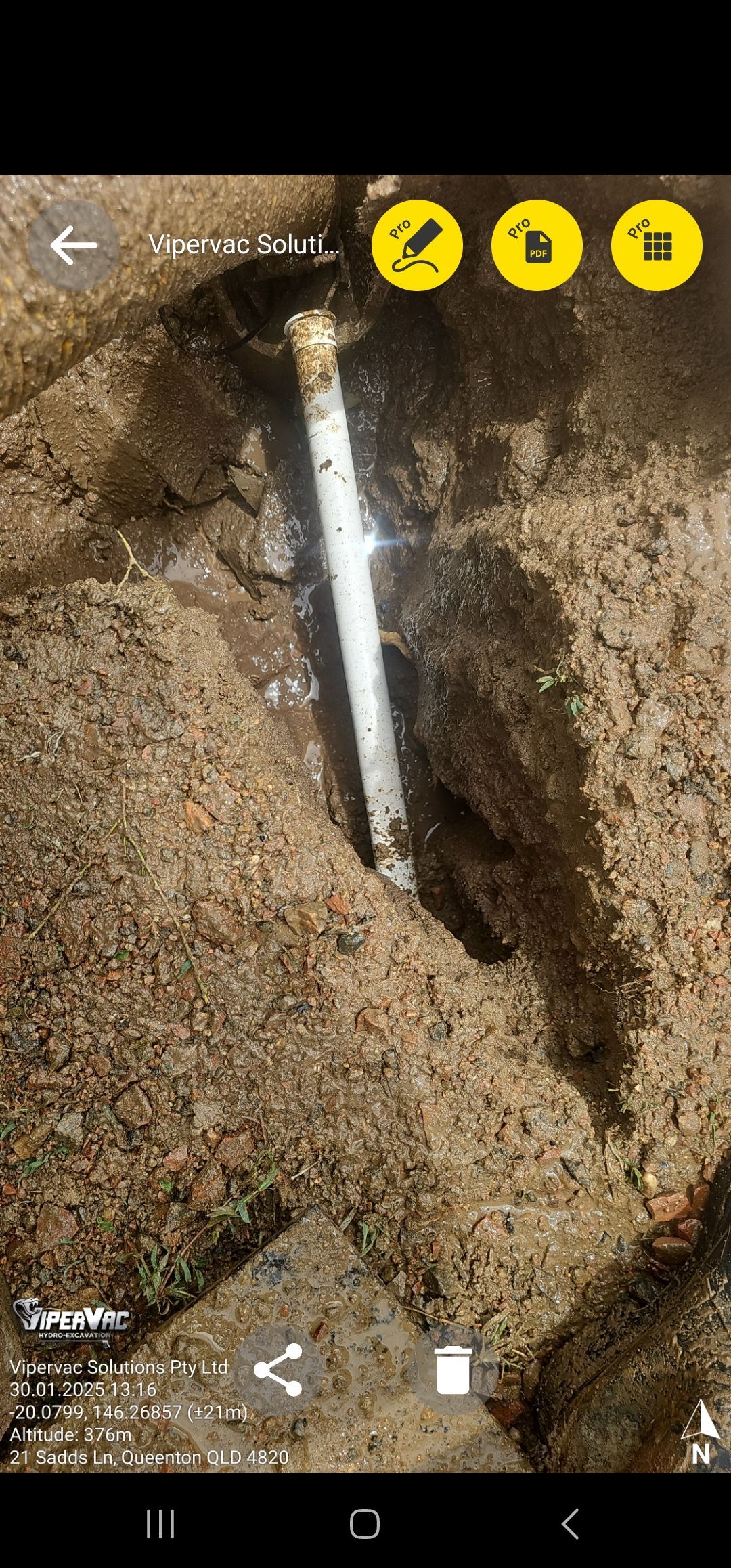 A white pipe is partially buried in dirt. Three yellow icons are in the top right — ViperVac Solutions PTY LTD in Cannonvale, QLD