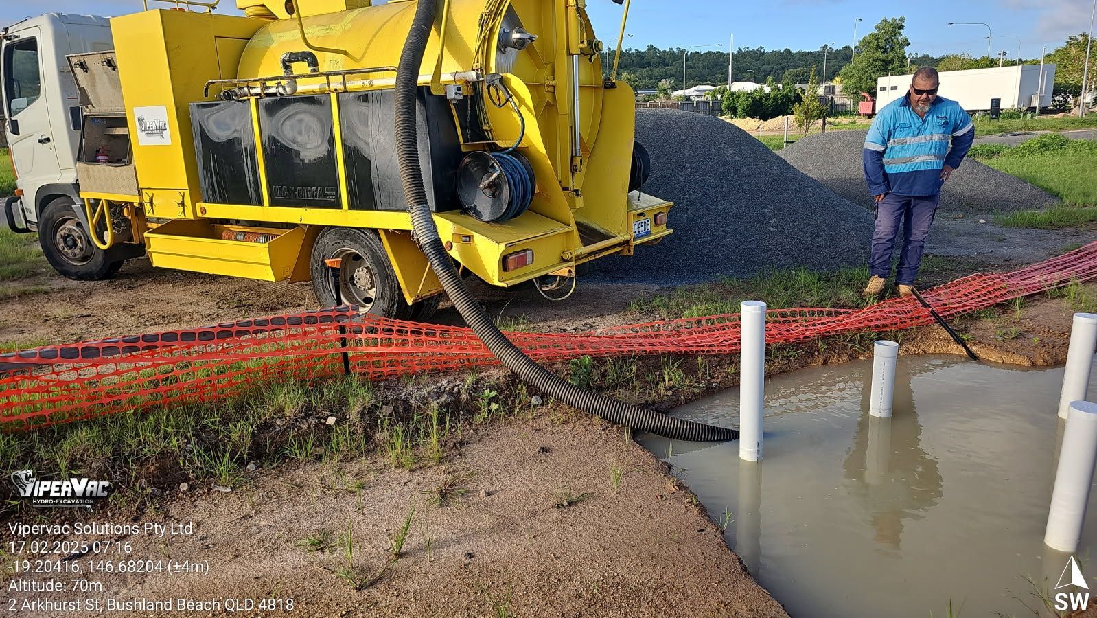 A Couple Of Palm Trees Standing Next To A Body Of Water — ViperVac Solutions PTY LTD in Airlie Beach, QLD