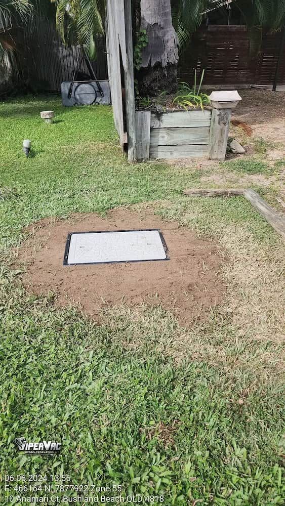 A White Box Is Sitting In The Middle Of A Lush Green Field — ViperVac Solutions PTY LTD in Bowen, QLD